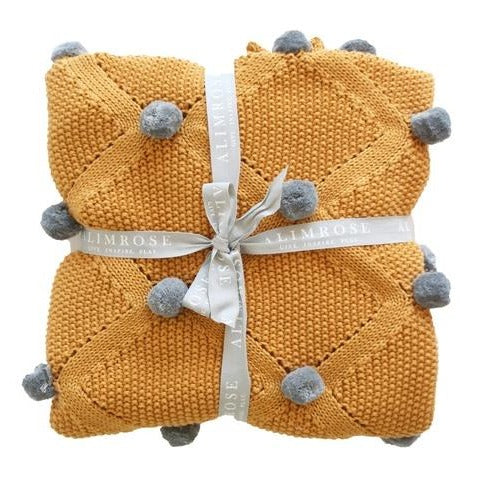 Unisex Baby Blanket Pom Pom Knit Butterscotch. Shop online or in store at Sticky Fingers Children's Boutique, Niddrie, Melbourne.