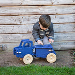Load image into Gallery viewer, Moover Blue Dump Truck, Wooden Ride On Toy, Sticky Fingers Children&#39;s Boutique
